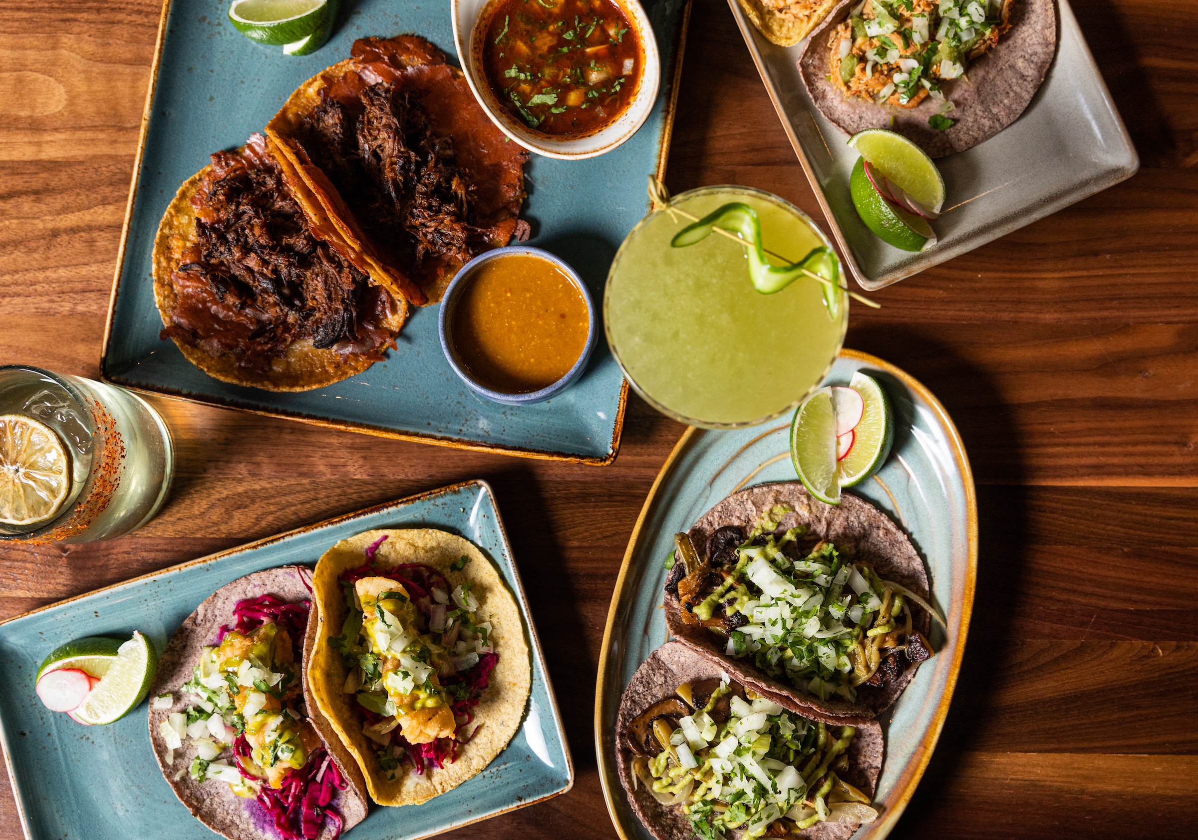 Various styles of tacos and cocktails in stylish plating at Masa & Agave of Hotel Ivy